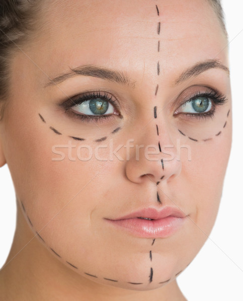 Calm woman ready for face lift on white background Stock photo © wavebreak_media