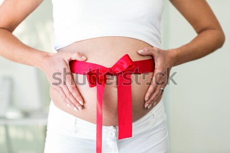 Stock fotó: Terhes · nők · áll · piros · íj · körül