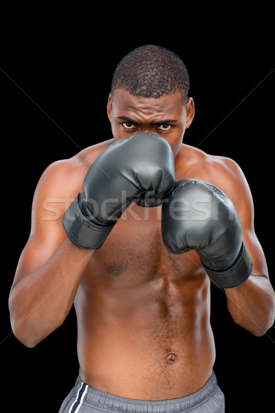 Stock photo: Portrait of a shirtless muscular boxer in defensive stance