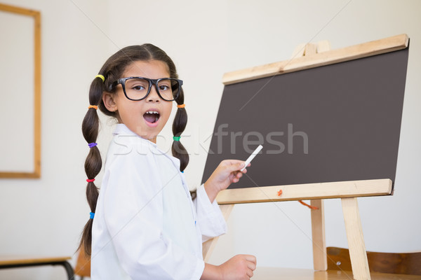 Cute pupil dressed up as scientist in classroom Stock photo © wavebreak_media