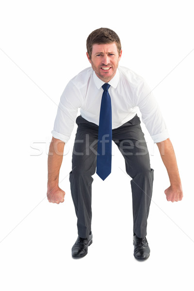 Businessman bending and lifting Stock photo © wavebreak_media