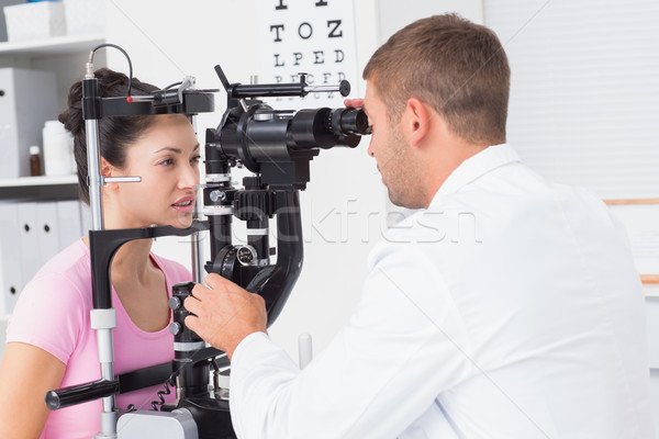 Female patient being examined by optician in clinic Stock photo © wavebreak_media