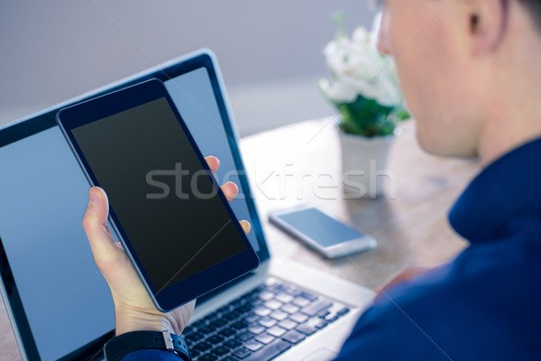 Rear view of businessman using tablet Stock photo © wavebreak_media