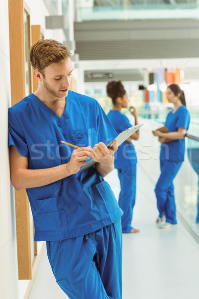 Medical student taking notes in hallway Stock photo © wavebreak_media