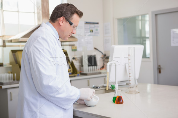 Scientist grinding powder with mortar Stock photo © wavebreak_media