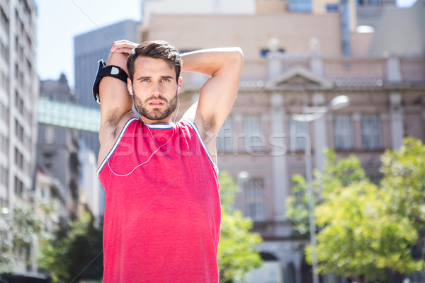 Handsome athlete doing arms stretching Stock photo © wavebreak_media