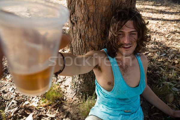 Unconscious man having beer in the park Stock photo © wavebreak_media