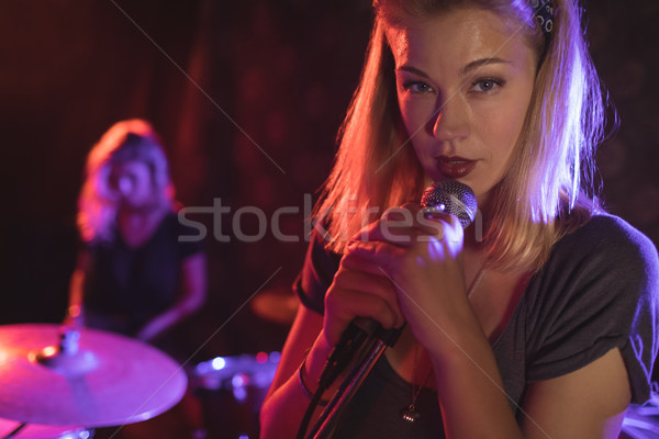 Portrait of singer performing with female drummer in nightclub Stock photo © wavebreak_media