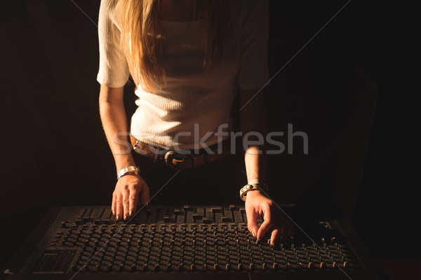 Mid section of female DJ operating sound mixer Stock photo © wavebreak_media