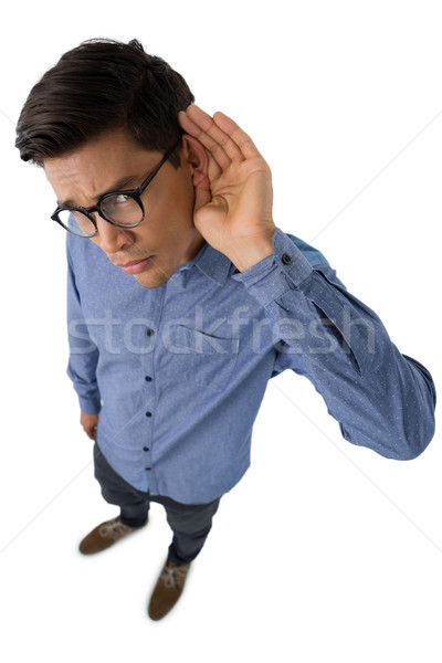 High angle portrait of businessman cupping ears Stock photo © wavebreak_media