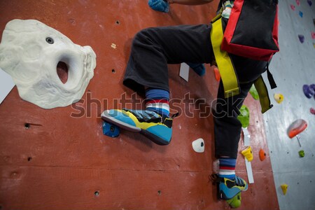 Determined boy practicing rock climbing Stock photo © wavebreak_media