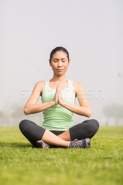 Peaceful sporty woman doing yoga Stock photo © wavebreak_media