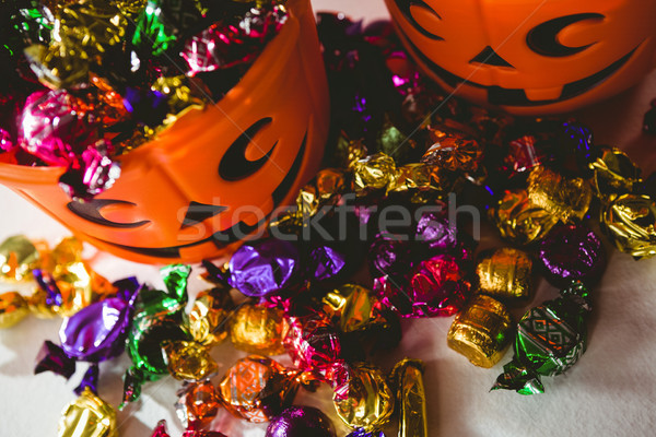 High angle view of orange buckets with colorful chocolates Stock photo © wavebreak_media