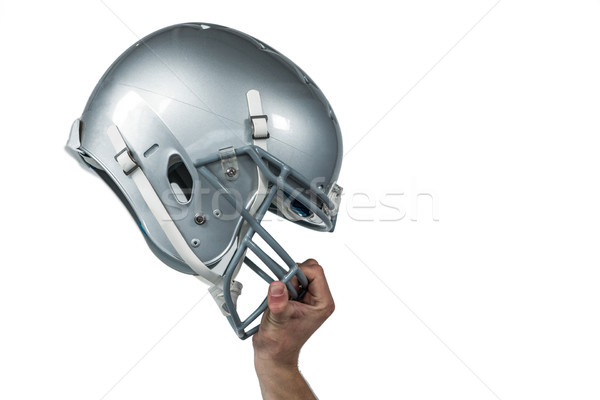 American football player handing his sliver helmet Stock photo © wavebreak_media