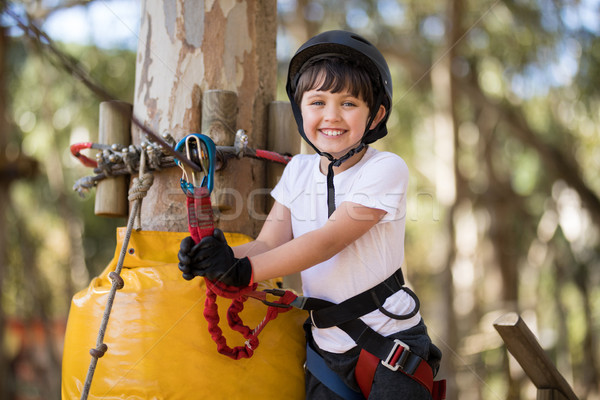Cute boy enjoying zip line adventure on sunny day Stock photo © wavebreak_media