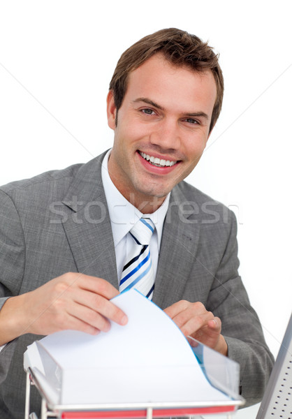 Confident young businessman studying a contract Stock photo © wavebreak_media