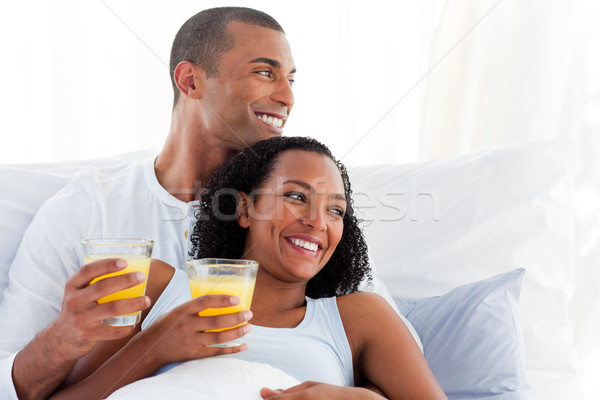 Romantic couple drinking orange juice  Stock photo © wavebreak_media