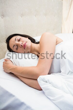 A relaxed man in his bed before waking up in his bedroom Stock photo © wavebreak_media