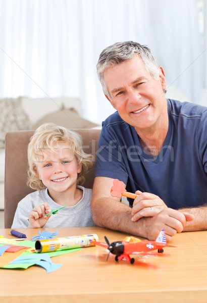 Little boy drawing with his grand father Stock photo © wavebreak_media