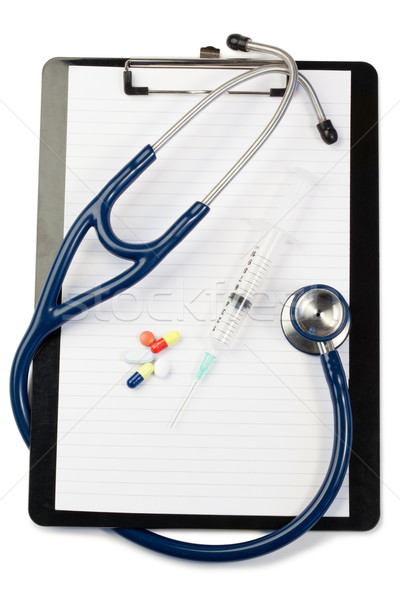 Note pad with blue stethoscope and pills on a white background Stock photo © wavebreak_media