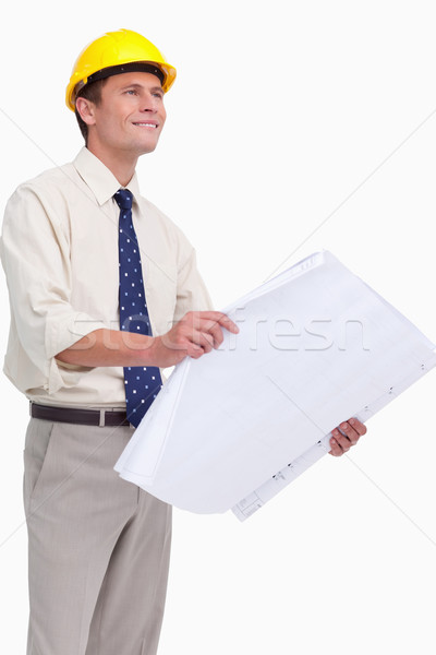 Architect with plans in his hands against a white background Stock photo © wavebreak_media