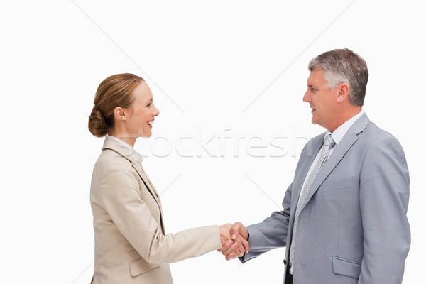 Business people shaking their hands against white background Stock photo © wavebreak_media
