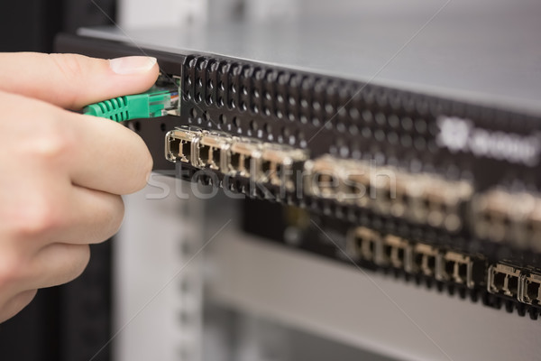 Woman plugging USB cable into server in data center Stock photo © wavebreak_media