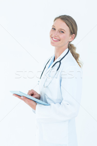 Doctor using tablet pc Stock photo © wavebreak_media