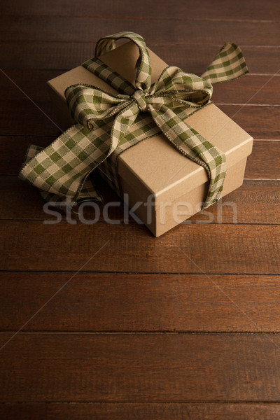 Stock photo: High angle view of gift box on brown table