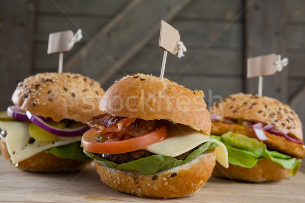 Különböző hamburger címke fa asztal közelkép étel Stock fotó © wavebreak_media