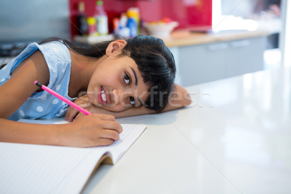 Magasról fotózva portré lány házi feladat konyhapult gyermek Stock fotó © wavebreak_media