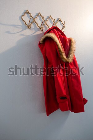 Warm clothes and bag hanging on hook Stock photo © wavebreak_media
