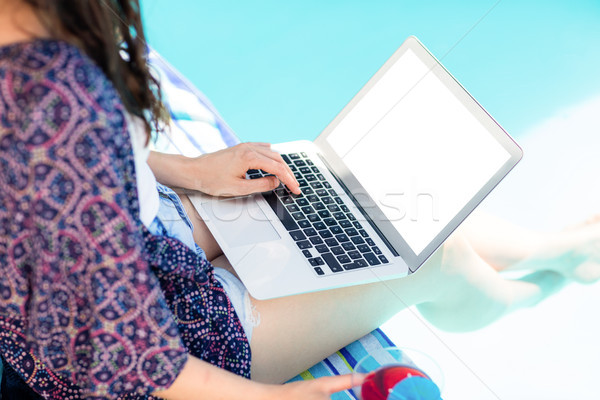 Woman using her laptop Stock photo © wavebreak_media