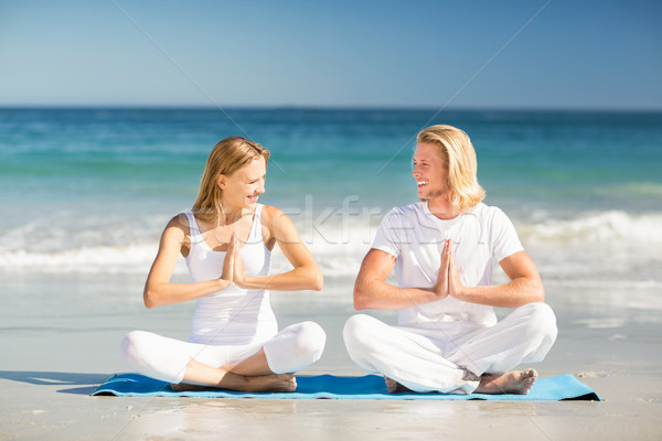 Man and woman performing yoga Stock photo © wavebreak_media