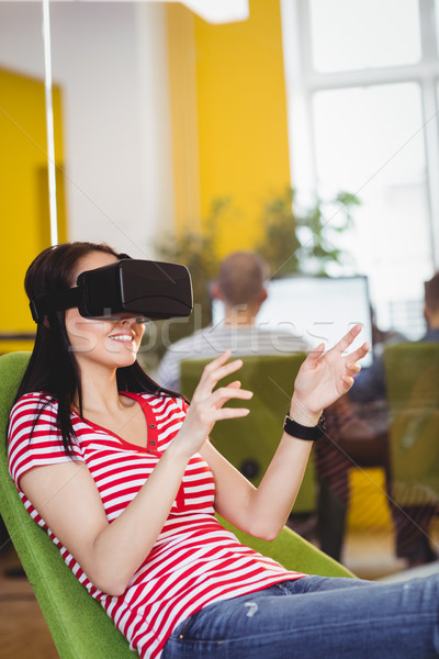 Young executive enjoying augmented reality glases at office Stock photo © wavebreak_media