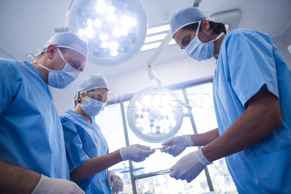 Group of surgeons performing operation in operation room Stock photo © wavebreak_media