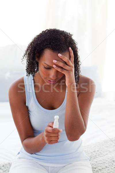 Upset woman finding out results of a pregnancy test  Stock photo © wavebreak_media