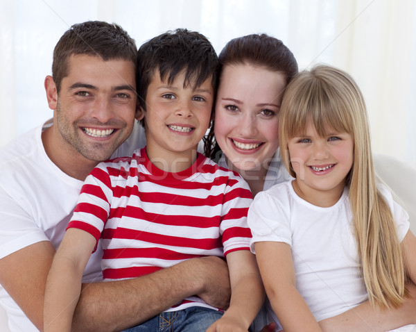 Portrait famille heureuse séance canapé ensemble living [[stock_photo]] © wavebreak_media