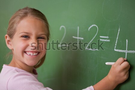 Schoolmeisje schrijven aantal Blackboard school student Stockfoto © wavebreak_media