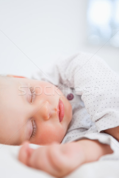 Baby sleeping while extending her arm Stock photo © wavebreak_media