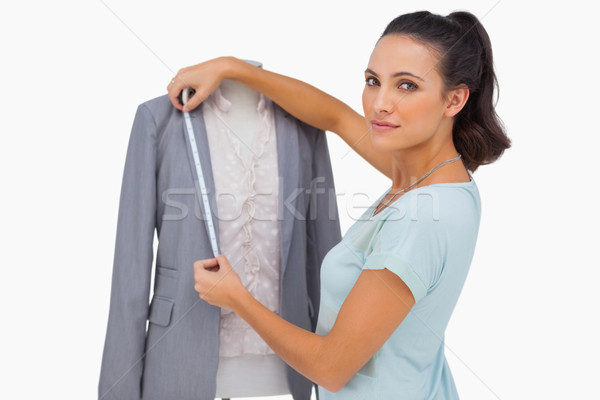 Designer measuring blazer on mannequin Stock photo © wavebreak_media
