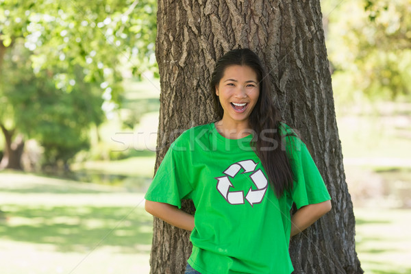 Smiling woman wearing green recycling t-shirt in park Stock photo © wavebreak_media