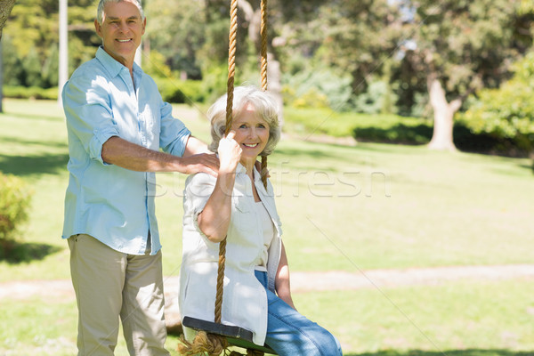 Stock photo: Portrait of a happy mature couple at park