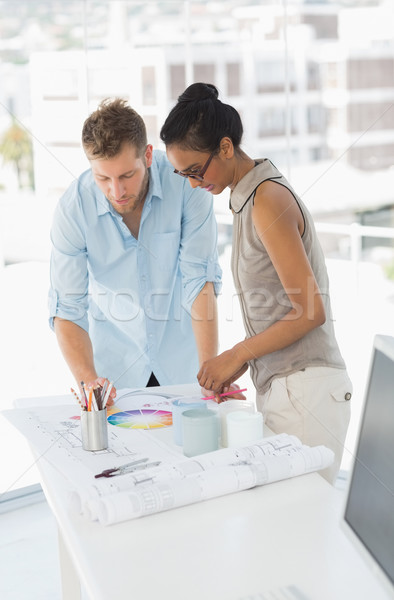 Interior designers looking at colour wheel and blueprints Stock photo © wavebreak_media