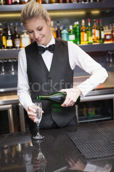 Cute Frau Anzug Gießen Champagner Flöte Stock foto © wavebreak_media