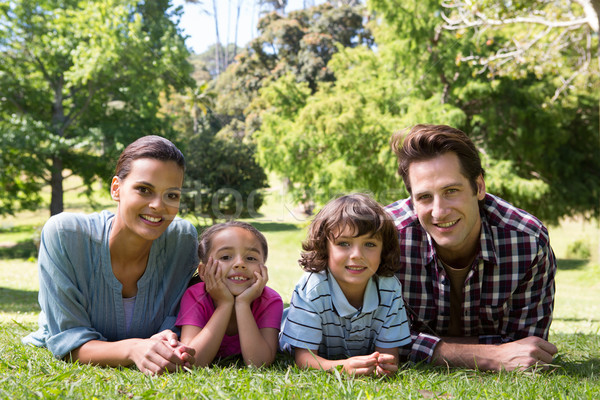 Happy family smiling at camera Stock photo © wavebreak_media