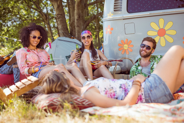 Happy hipsters relaxing on the campsite Stock photo © wavebreak_media
