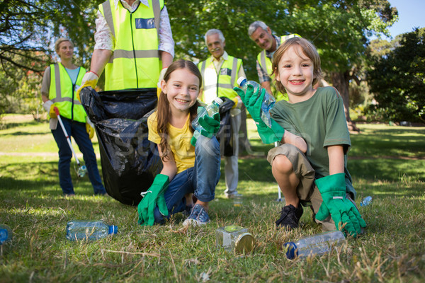 Happy family collecting rubbish  Stock photo © wavebreak_media