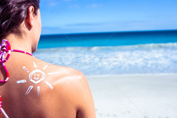 Brunette with sun tan lotion on her shoulder Stock photo © wavebreak_media