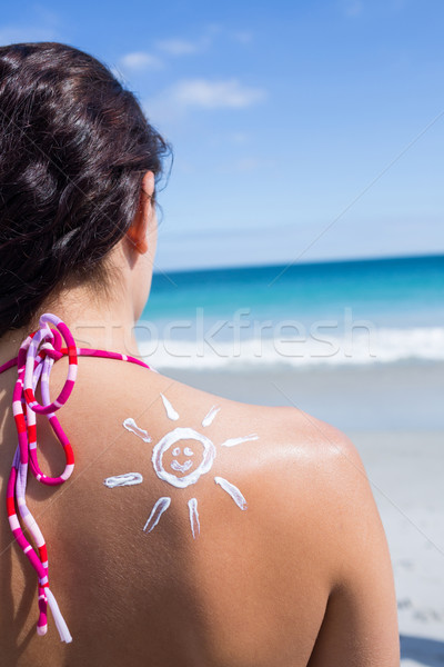 Brunette with sun tan lotion on her shoulder Stock photo © wavebreak_media